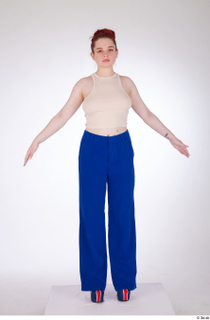Yeva a-pose beige crop top blue pants casual dressed standing…